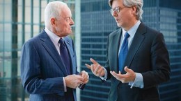 A photo showing Peter Munk (left) in discussion with John Thornton (right) taken from Barrick Gold's 2012 Annual Report. Credit: Barrick Gold