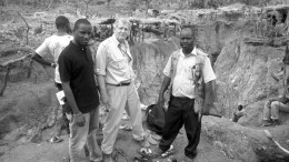 Surrounded by artisanal workings at the Diakha discovery zone at Merrex Gold and Iamgold's Siribaya gold project in Mali, from left (facing the camera): Aboubacar (Eby) Sylla, owner of Touba Mining, a strategic project partner; Greg Isenor, president of Merrex Gold; and Mamadou Diallo, Touba Mining geologist. Credit: Merrex Gold