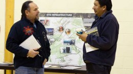 Noront Resources' VP of Aboriginal affairs Glenn Nolan (left) and a local community member discuss proposed infrastructure for the Eagle's Nest nickel-copper-PGM project in Ontario's James Bay Lowlands. Credit: Noront Resources