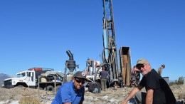 Geologist Dan Ferraro (left) and Goldspike Exploration president and CEO Bruce Durham in front of a drill rig at the Lone Mountain zinc-lead project in Nevada.  Credit: Goldspike Exploration