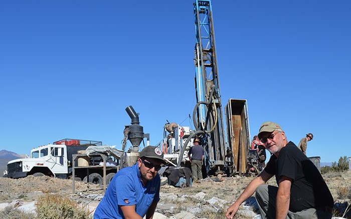 Geologist Dan Ferraro (left) and Goldspike Exploration president and CEO Bruce Durham in front of a drill rig at the Lone Mountain zinc-lead project in Nevada.  Credit: Goldspike Exploration