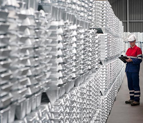 A worker inspects zinc ingots at Nyrstar's Overpelt zinc smelting plant in Belgium. Credit: Nyrstar