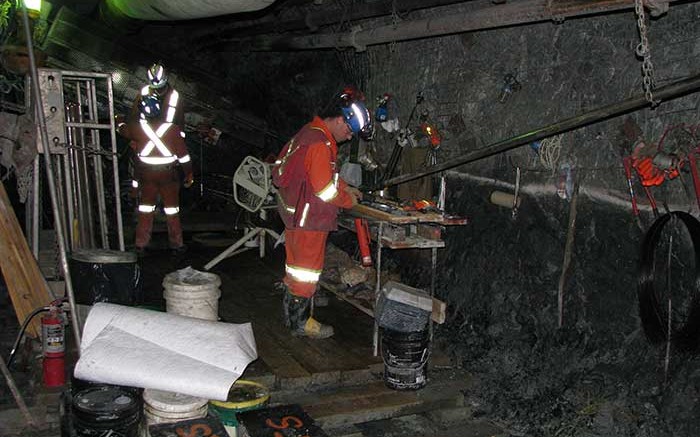 Geologist Scott Taylor examines core samples on a drill platform 244 metres underground at Rubicon Minerals' Phoenix F2 gold deposit in northwestern Ontario. Credit: Rubicon Minerals