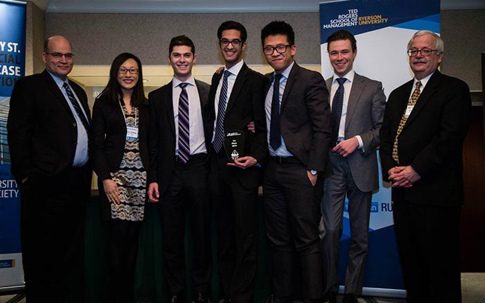 The Schulich School of Business team receiving their award for wining this year's "Battle on Bay" competition in Toronto, from left: Allen Goss, chair of finance, Ryerson University; Ophelia Chang, IT audit manager, Sunlife Financial; Schulich students Ron Burshtein, Jawad Shujaatali and Jonathan Kim; Ian Ball, president of Abitibi Royalties; and Ernie Lalonde, senior VP of DBRS. Credit: Ryerson University Finance Society