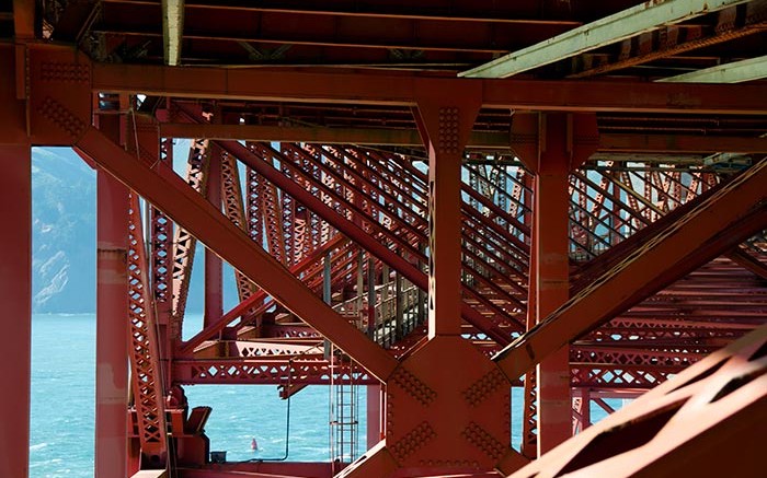 Steel beams on the underside of the Golden Gate Bridge in California.  Photo by Russ Sanderlin.