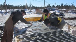 Mega Precious Metals personnel review core samples at the Monument bay gold-tungsten project, 340 km southeast of Thompson, Manitoba. Credit:  Mega Precious Metals