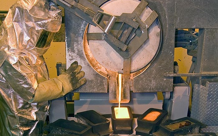 A worker pours gold at Barrick Gold's refinery at the Goldstrike gold mine in Nevada.  Credit: Barrick Gold