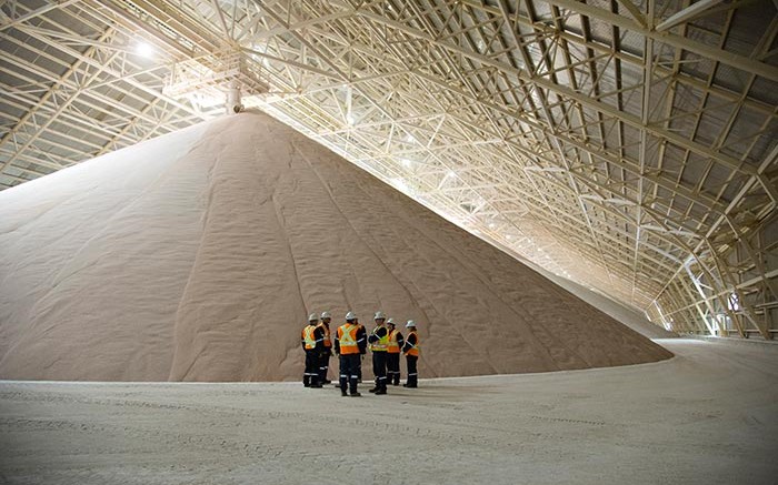 Workers near a stockpile at Potash Corp. of Saskatchewan's Rocanville potash mine in southeast Saskatchewan. Credit: Potash Corp. of Saskatchewan