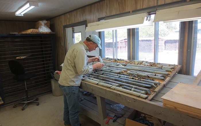 Peter Harvey, senior project geologist, examines core samples at Temex Resources and Goldcorp's Whitney gold project in Ontario.  Source: Temex Resources