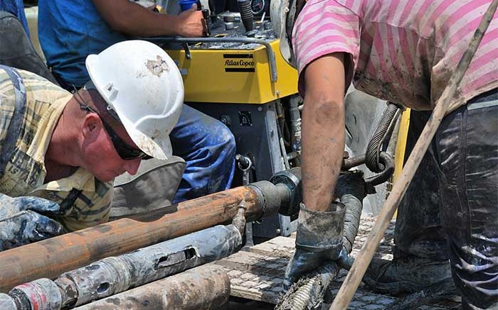 Workers at the Cukaru Peki drilling site. Source: Reservoir Minerals