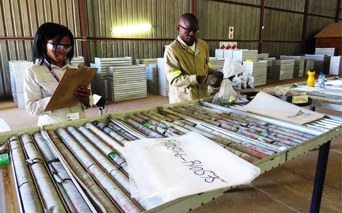 Employees examine samples inside Ivanhoe Mines' Platreef core shed. Source: Ivanhoe Mines