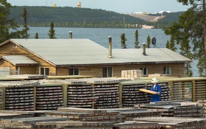 A worker handles core at Cameco's Cigar Lake uranium mine in Saskatchewan. Credit: Cameco