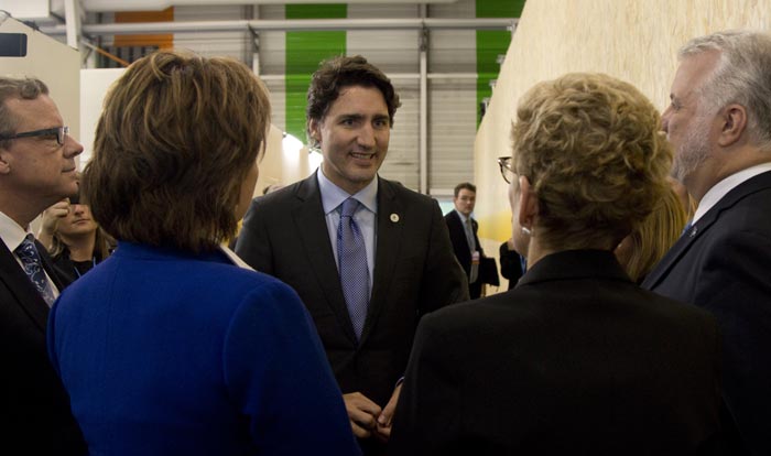 Canada's Prime Minister Justin Trudeau (centre) speaks with provincial premiers during the 2015 Paris Climate Conference. Credit: Province of British Columbia