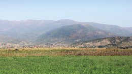 The hill where Euromax Resources' Ilovica copper-gold porphyry lies, beyond the villages of Ilovica and Shtuka in Macedonia.Credit: Euromax Resources