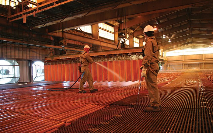 Workers spray copper cathode at Barrick Gold and Antofagasta's Zaldivar copper mine in northern Chile. Credit: Barrick Gold