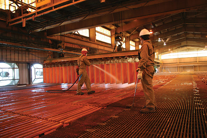 Workers spray copper cathode at Barrick Gold and Antofagasta's Zaldivar copper mine in northern Chile. Credit: Barrick Gold 