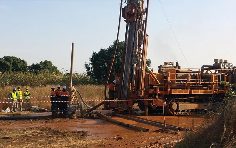 Workers with a reverse-circulation drill at Semafo’s Natougou gold project, 320 km east of Ouagadougou, Burkina Faso.  Credit: Semafo