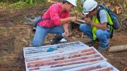 Workers study drill core at RTG Mining's Mabilo copper-gold-magnetite project in southeastern Luzon in the Philippines. Credit: RTG Mining