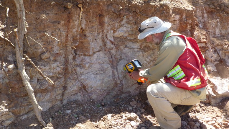 Geologist Dale Brittliffe collects data with a handheld XRF unit at an outcrop on Orex Minerals and Canasil Resources’ Sandra Escobar silver project in Durango state, Mexico.  Photo by Ben Whiting.