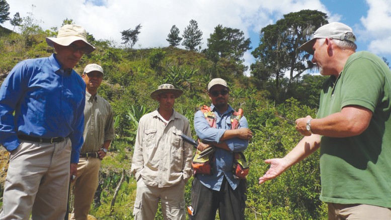 Talking geology at the GoldQuest Mining’s Romero gold-copper project in the Dominican Repubic, from left: president and CEO Julio Espaillat, country manager Felix Mercedes, senior field technician Franklin Nunes, senior project geologist Noverto Gonzalez and executive chairman Bill Fisher.  Photo by David Perri.