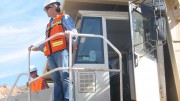 Rob McEwen perched on a large mining truck at McEwen Mining's El Gallo gold project in Mexico. Credit: McEwen Mining.