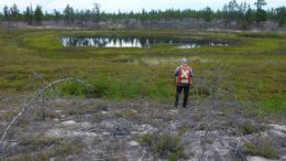A geologist overlooks a potential kimberlite target at CanAlaska's West Athabasca diamond project in the Athabasca Basin of northwest Saskatchewan. Credit: CanAlaska Uranium.