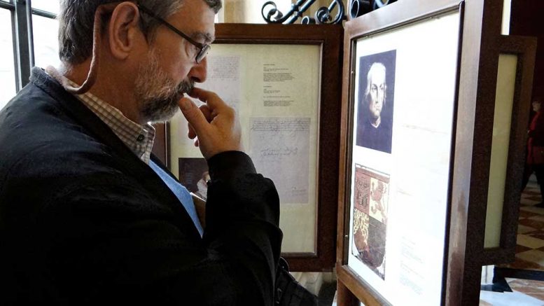 Keith Barron reading a letter by Columbus, at the General Archive of the Indies in Seville, Spain.  Photo courtesy Keith Barron.