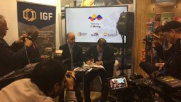 Ecuador's mines minister Javier Cordova signs agreement to join IGF, as IGF director Greg Radford looks on. The signing took place on March 7 at the PDAC convention. Photo by Salma Tarikh