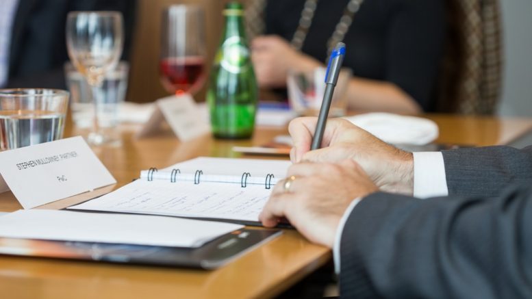 Taking notes during the PwC-TNM "Strategies for Cash Deployment" roundtable in Toronto in April 2017: Stephen Mullowney, partner in the corporate finance practice, focusing on mining, at accounting and management consulting firm PwC Canada. Credit: Erik Rotter for George Matthew Photography.