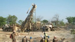 Workers oversee a drill rig at African Gold Group's Kobada project in Mali. Credit: African Gold Group.
