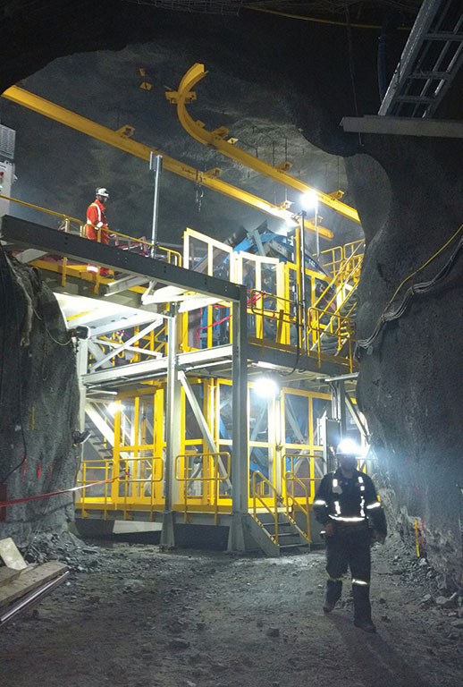 Workers at a section of the Rail-Veyor system at Agnico Eagle Mines’ Goldex underground gold mine near Val-d’Or, Quebec. Photo by Jon Cumming.