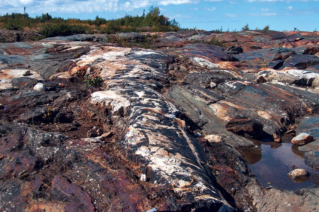 An outcrop with visible veining and “piano key” breccia at the proposed pit location Eastmain Resources’ Eau Claire gold project in Quebec’s James Bay region. Credit: Eastmain Resources.
