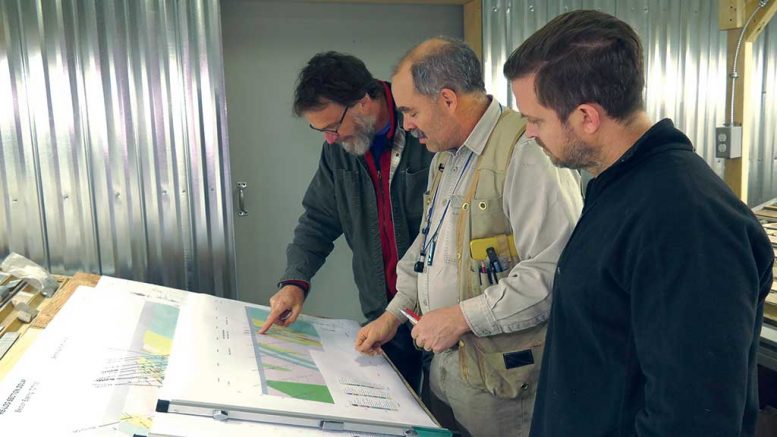 Examining maps at Maple Gold Mines’ Douay gold project in Quebec, from left: David Broughton, director and head of the technical committee; Fred Speidel, vice-president of exploration; and Matthew Hornor, president and CEO. Credit: Maple Gold Mines.