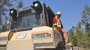 A worker on a tractor at Avalon Advanced Materials’ Separation Rapids lithium project in Ontario. Credit: Avalon Advanced Materials.