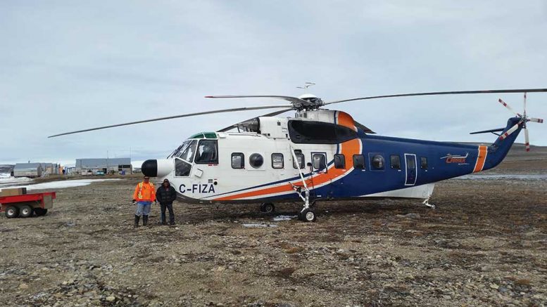 Peregrine Diamonds’ employees with a Helicarrier heavy-lift helicopter at the Chidliak diamond project on Baffin Island, Nunavut, in July 2017. Credit: Peregrine Diamonds.