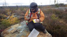 Altius Minerals geologist Nick Barnable takes field notes in Newfoundland. Credit: Altius Minerals.