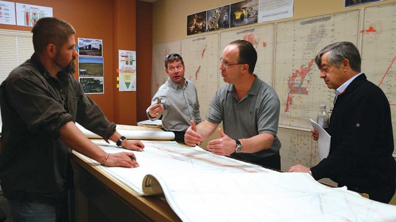 At Cartier Resources’ offices in Val-d’Or, Quebec, from Left: Eric Lemieux, mine and exploration analyst; Alain Beland, investor relations consultant; Gaétan Lavallière, vice-president of exploration; and Jerome Gendron, shareholder. Credit: Cartier Resources.