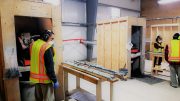 First Mining Staff cut core at Goldlund's facility near Dryden, Ontario. Credit: First Mining.