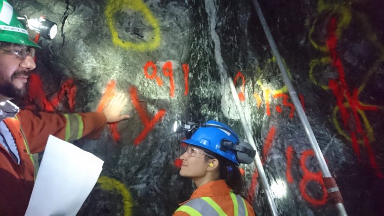 Alamos Staff indicate points of interest on a the face of a tunnel more than 800 metres underground at the Island Gold mine. Photo by Richard Quarisa.