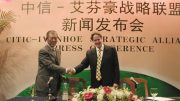 Ivanhoe founder Robert Friedland shakes hands with former CITIC chairman Wang Jun in 2003. Credit: Ivanhoe Mines.