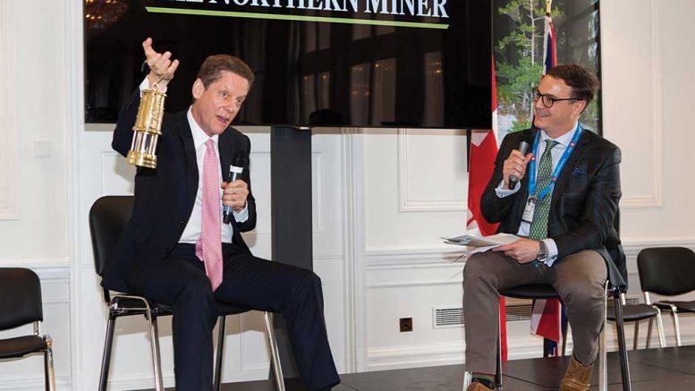 Robert Friedland, executive chairman of Ivanhoe Mines, hoists his Lifetime Achievement Awards at the The Northern Miner’s 2017 Canadian Mining Symposium in London, United Kingdom. Photo by The Northern Miner.