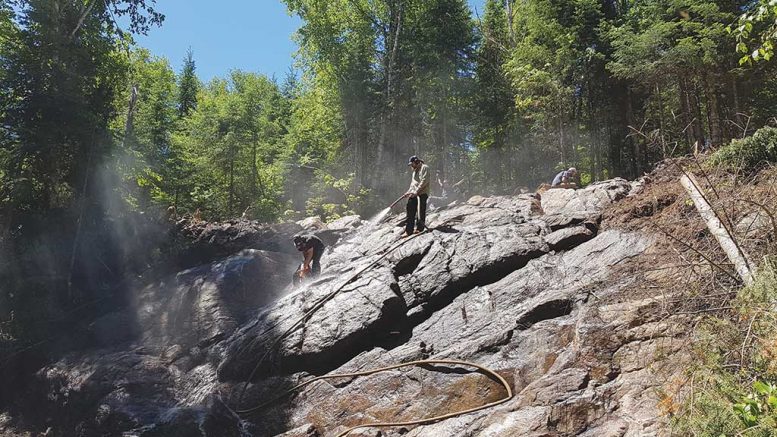 Workers cleaning a trench at Kintavar Exploration’s Mitchi copper project in Quebec. Credit: Kintavar Exploration.