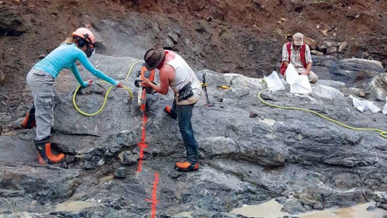 Workers cutting a channel at Mitchi. Credit: Kintavar Exploration.