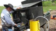 Robbie Grubbs, environmental engineer, collects baseline ground water samples at Rare Element Resources' Bear Lodge REE property, in support of the Wyoming project's environmental impact statement, currently underway. Credit: Rare Element Resources.