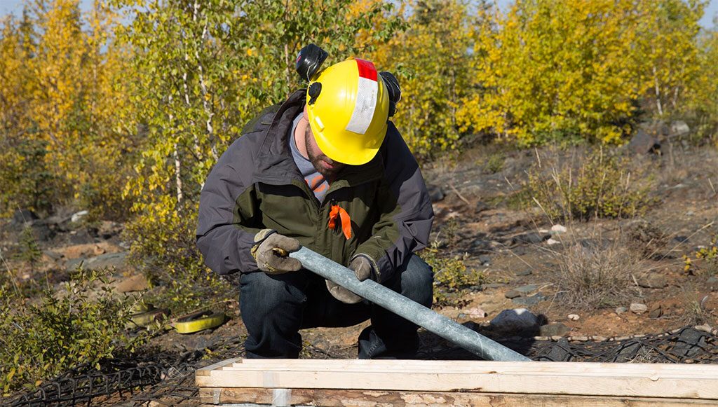 Nighthawk staff inspecting core samples at the Indin Lake gold property. Credit: Nighthawk.