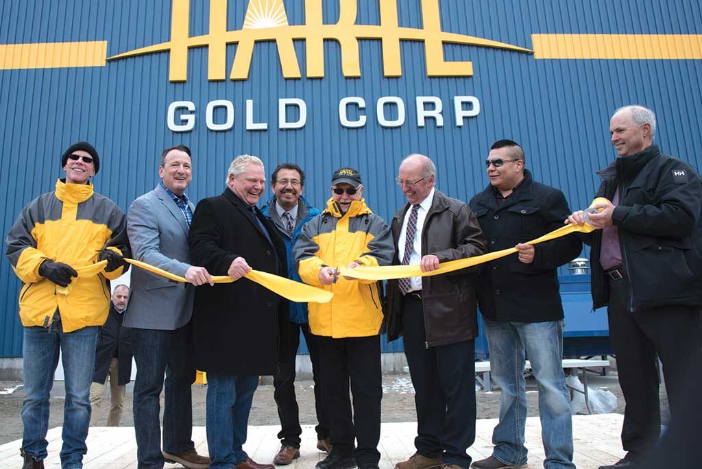 Cutting the ribbon at Harte Gold’s Sugar Zone gold mine in Ontario, from left: Timothy Campbell, Harte Gold VP and corporate secretary; Greg Rickford, Ontario Minister of Energy, Mines, Northern Development and Indigenous Affairs; Doug Ford, Premier of Ontario; Jeff Desmoulin, former chief of Pic Mobert First Nation; Stephen Roman, Harte Gold president and CEO; Angelo Bazzoni, mayor of White River; Louis Kwissiwa, acting chief of Pic Mobert First Nation; and Roger Emdin, Harte Gold VP of operations. Credit: Harte Gold.