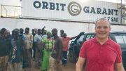 Sylvain Drolet (far right), director general of Orbit Garant Burkina Faso, at the company’s office in Burkina Faso. Credit: Orbit Garant.