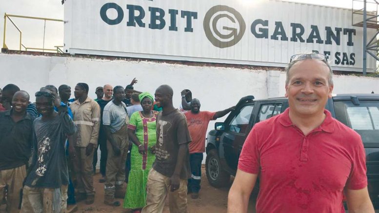 Sylvain Drolet (far right), director general of Orbit Garant Burkina Faso, at the company’s office in Burkina Faso. Credit: Orbit Garant.