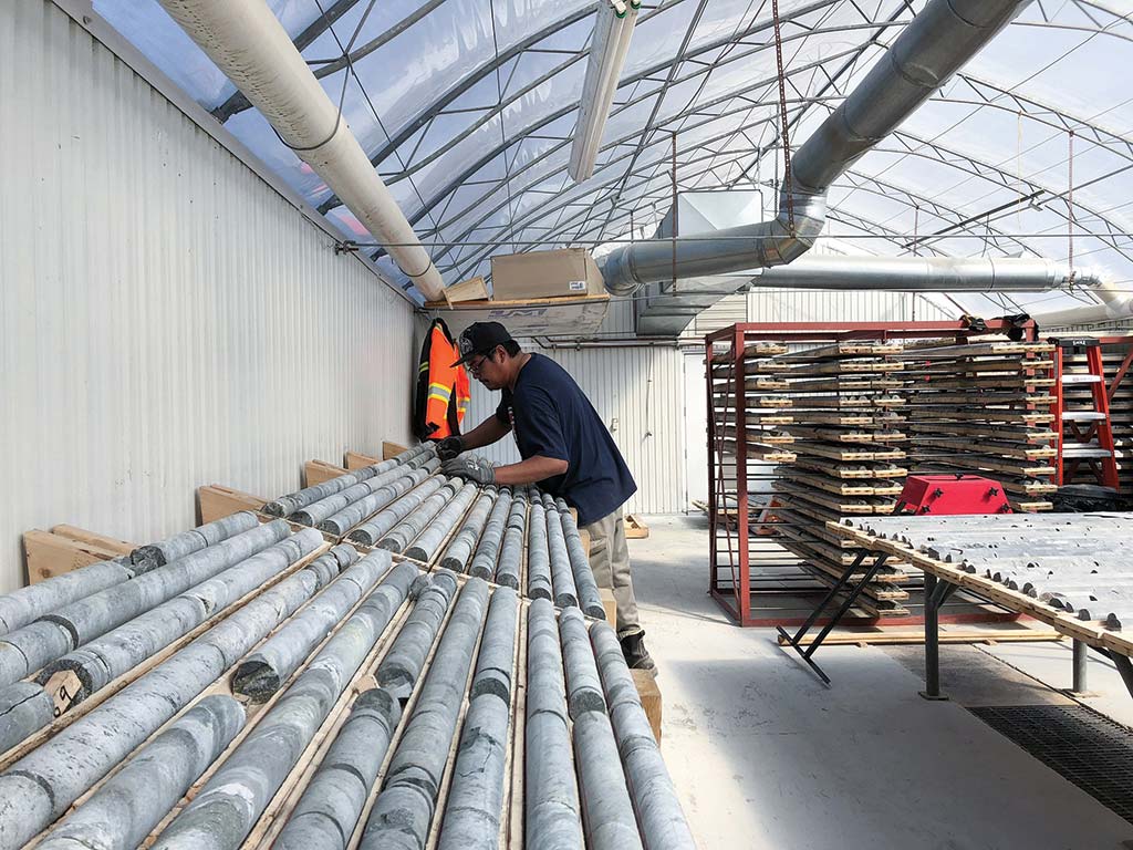 A worker in the core shack at the Troilus gold project. Credit: Troilus Gold.