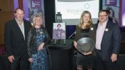 Banyan Gold president and CEO Tara Christie (holding award) accepts the Yukon Women in Mining Kate Carmack Award in 2018 for excellence in championing women within the industry, alongside (from left) her brother Seamus Christie, mother Dagmar Christie and husband John McConnell. Credit: Yukon Women in Mining.